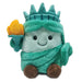Plush toy resembling the Statue of Liberty on a white background
