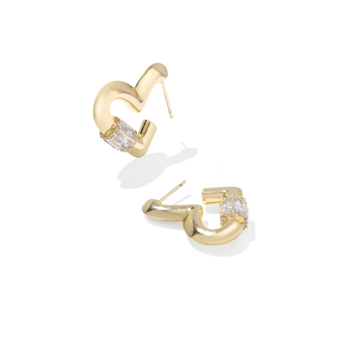 Gold hoop earrings with clear gemstones on a white background