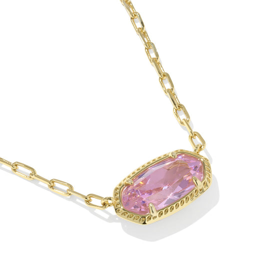 Gold necklace with a pink gemstone on a white background