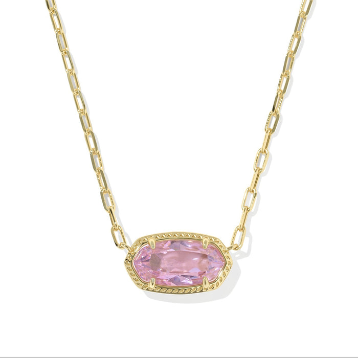 Gold necklace with a pink gemstone pendant on a white background