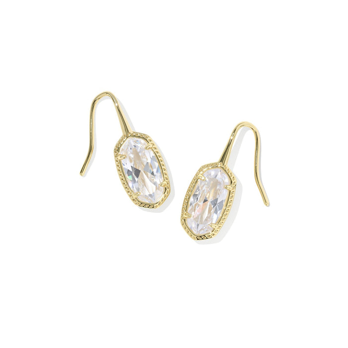 Gold earrings with clear gemstones on a white background