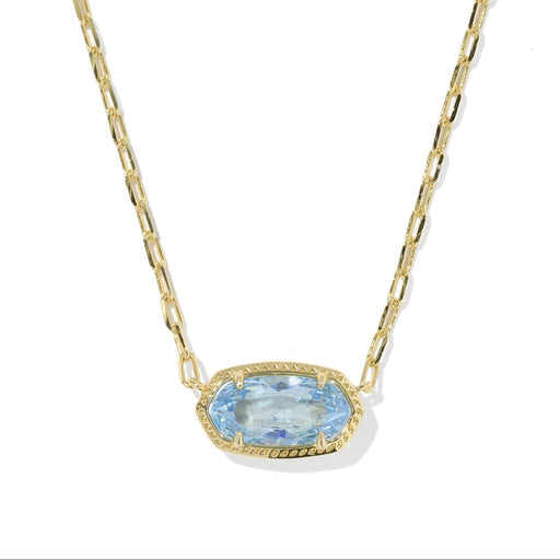 Gold necklace with a blue gemstone pendant on a white background