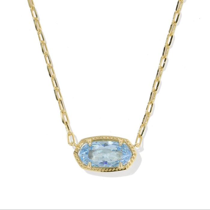 Gold necklace with a blue gemstone pendant on a white background