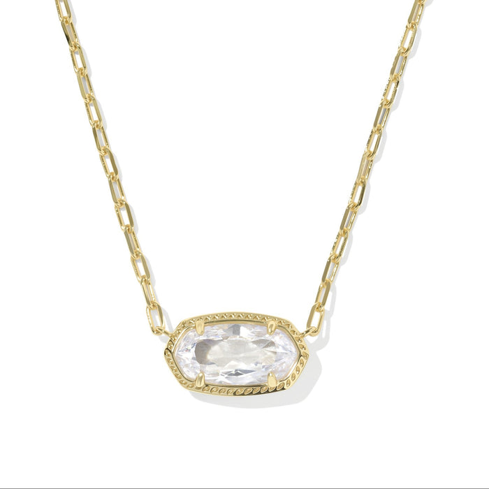 Gold necklace with a clear gemstone pendant on a white background
