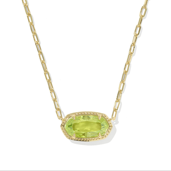 Gold necklace with a green gemstone pendant on a white background