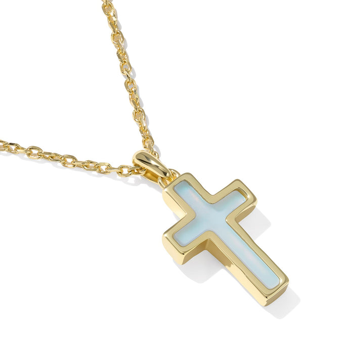 Gold cross pendant necklace on a white background