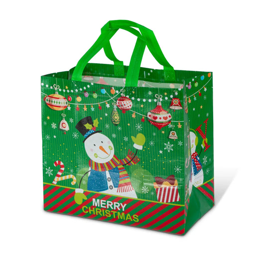 A green Christmas-themed reusable plastic gift bag with green handles, featuring a snowman, ornaments, candy canes, and a 'MERRY CHRISTMAS' banner on a white background.