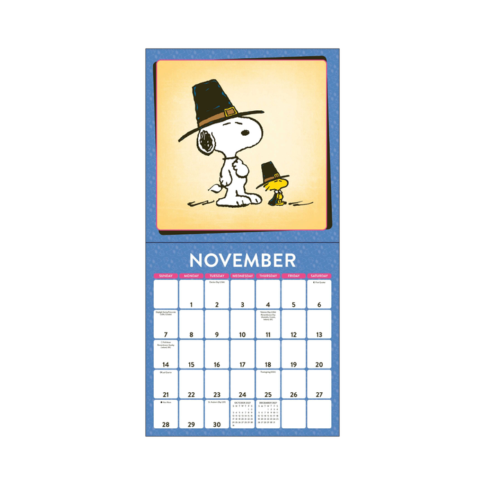 Calendar for November with Snoopy and Woodstock wearing Thanksgiving hats on a blue border.