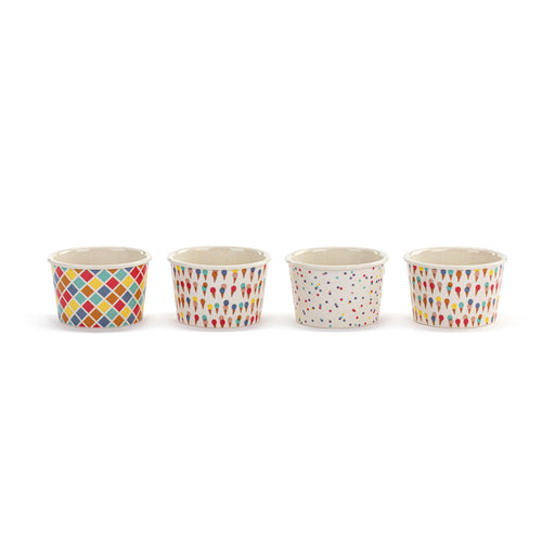 Four small ceramic cups with colorful patterns on a white background