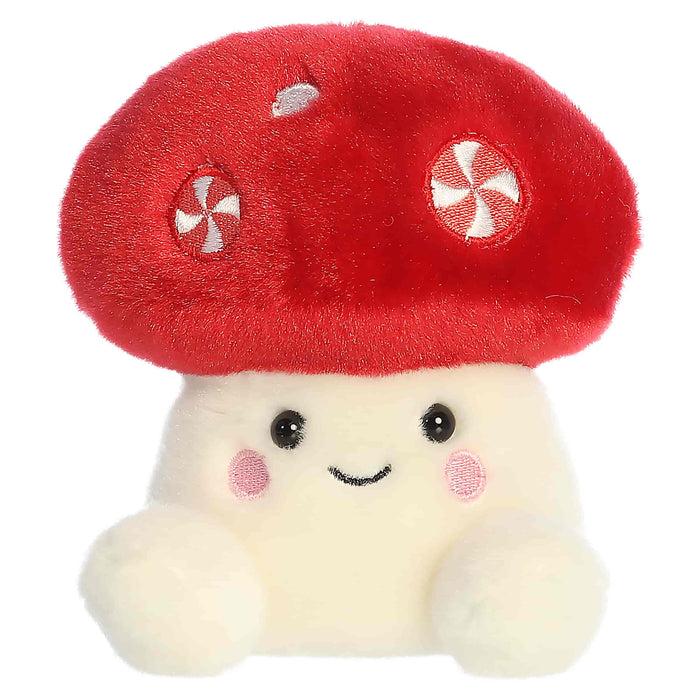 Plush toy resembling a mushroom with a red cap and white body on a white background