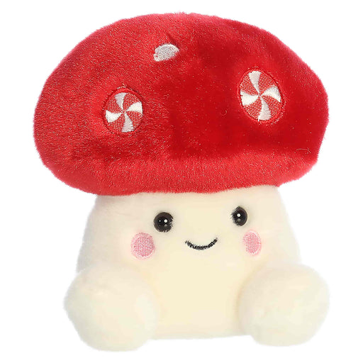 Plush toy shaped like a mushroom with a red cap and white body on a white background