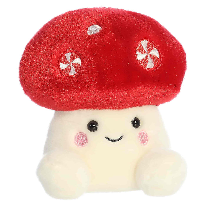 Plush toy shaped like a mushroom with a red cap and white body on a white background