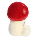 Plush toy with a red cap and white face on a white background
