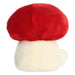 Red mushroom-shaped plush on a white background