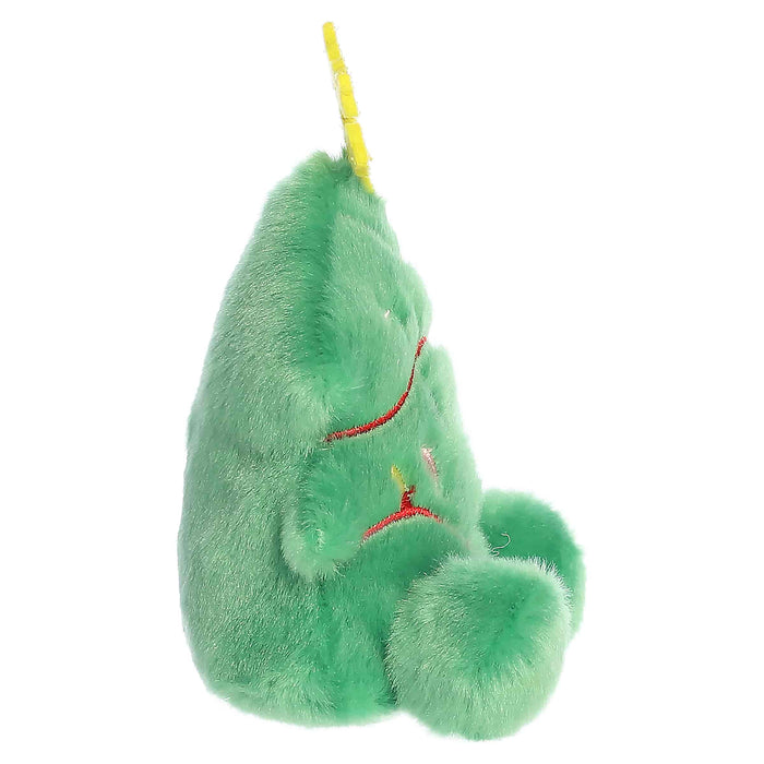 Green plush toy with a yellow string on a white background