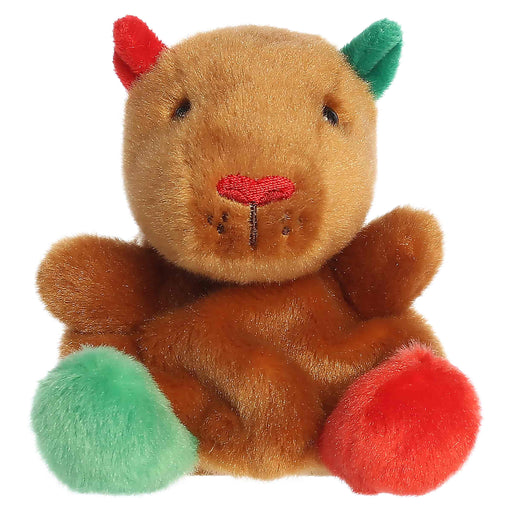 Plush toy resembling a bear with red and green accents on a white background