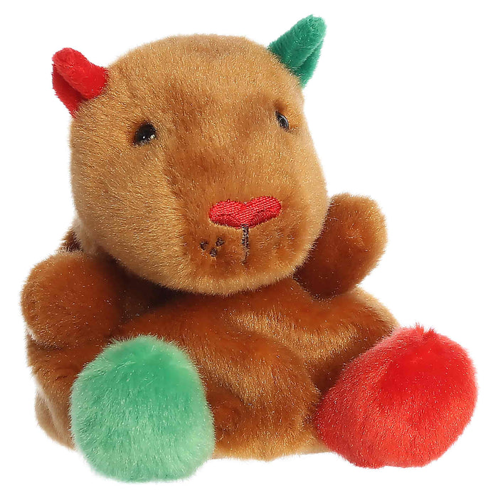 Plush toy resembling a brown creature with red and green accents on a white background