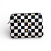 Checkered pouch with cartoon character illustrations on a white background