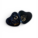 Navy blue heart-shaped jewelry pouch with embroidered designs on a white background