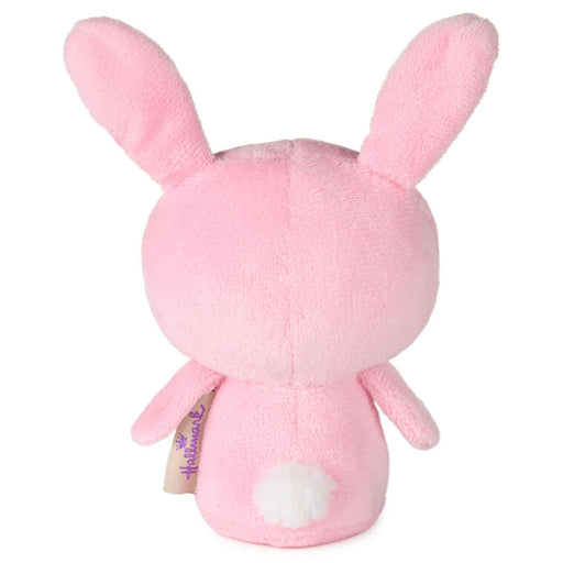 Pink plush toy with bunny ears on a white background
