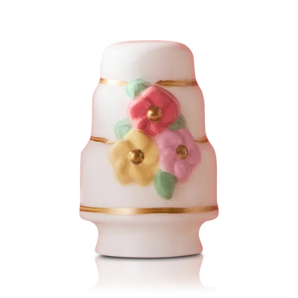 Decorative ceramic jar with floral designs on a white background
