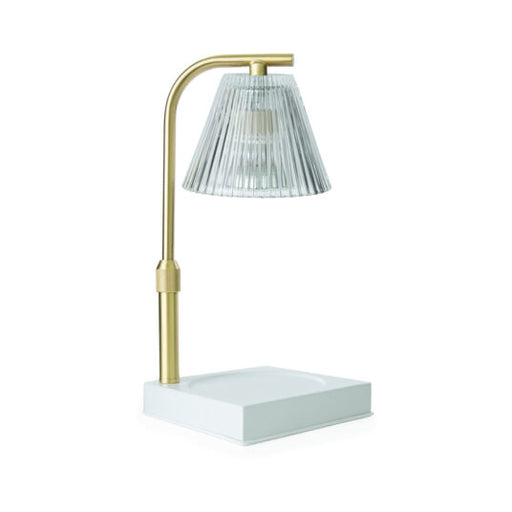 Modern table lamp with gold base and clear glass shade on a white background