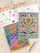 Colorful planner with floral design and text on a wooden surface