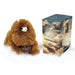Brown plush alpaca toy next to its packaging on a white background