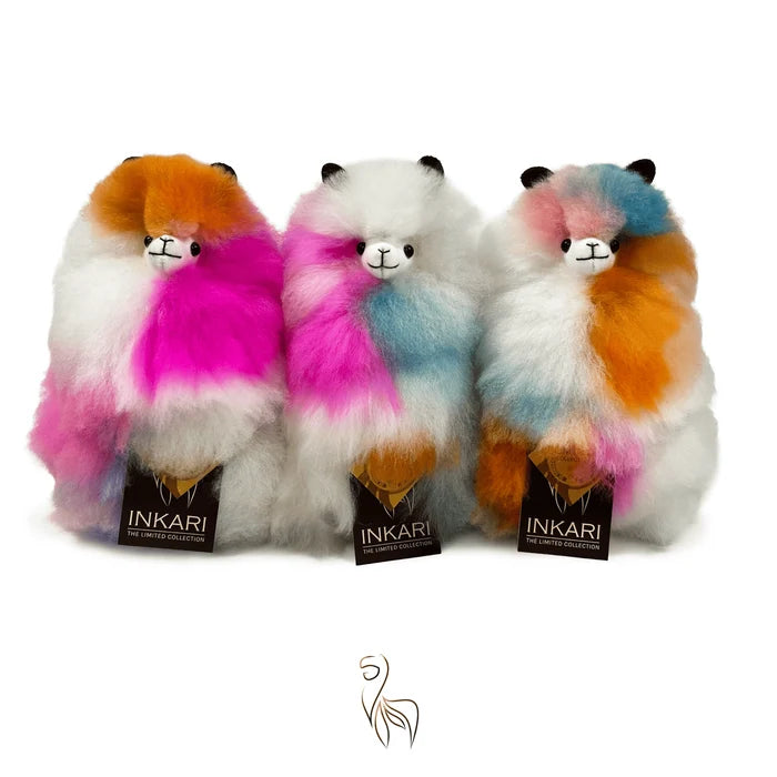 Three colorful stuffed animals with multicolored fur, each labeled 'INKARI', on a white background.