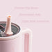 Pink insulated cup with straw feature and text on a pink background