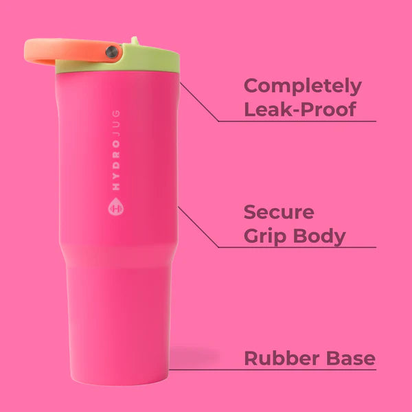 Pink HydroJug tumbler with green lid on a pink background, featuring text about its features.