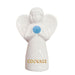 White angel figurine with a blue breast and 'COURAGE' text on a white background