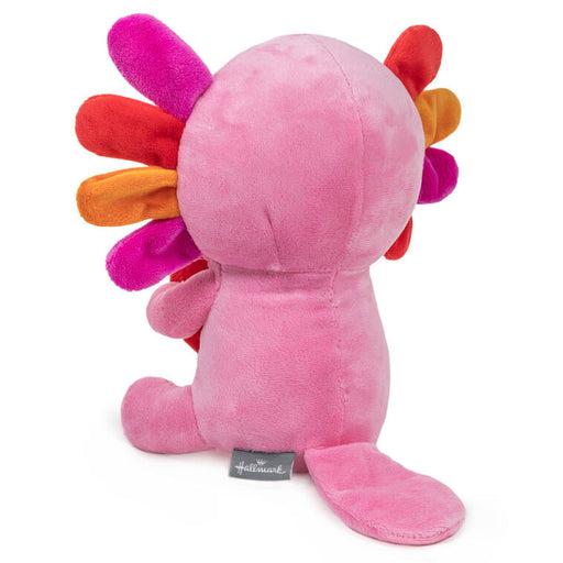 Pink plush toy with colorful spikes on a white background