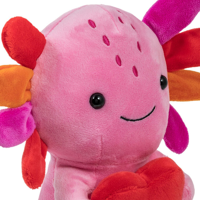 Pink plush toy with colorful flower-like arms on a white background