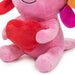 Pink plush toy holding a red heart on a white background