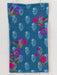 Floral patterned fabric on a wooden surface