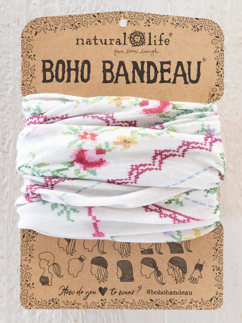 Floral bandeau on a 'Natural Life' branded card with packaging design.