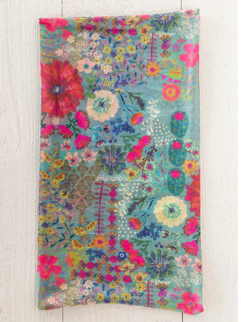 Colorful floral patterned fabric on a wooden surface
