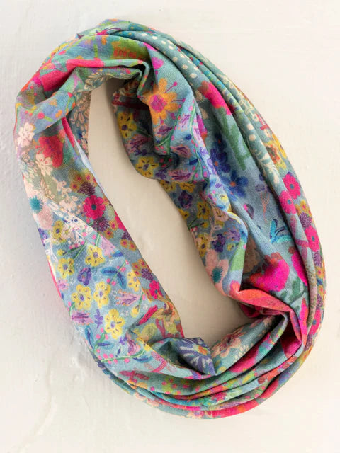Colorful floral patterned infinity scarf on a white background