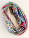 Colorful floral patterned infinity scarf on a white background