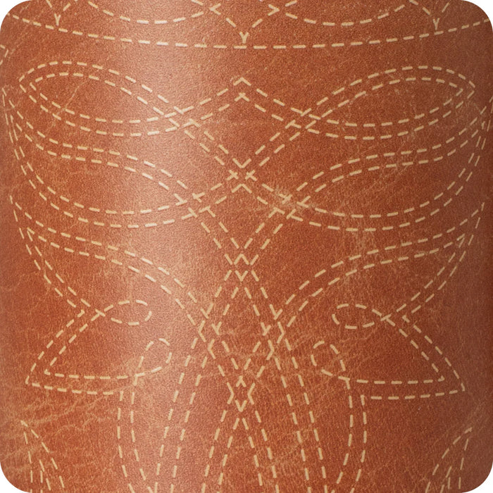 Close-up of brown leather with white stitching pattern