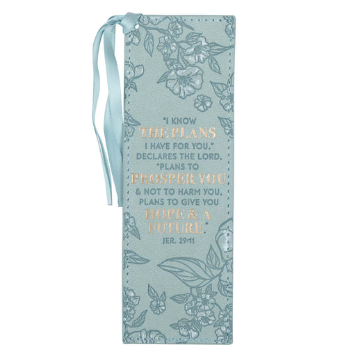 Decorative bookmark with floral designs and inspirational text on a light blue background