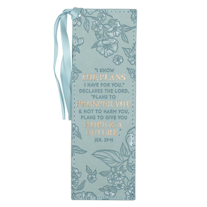 Decorative bookmark with floral designs and inspirational text on a light blue background