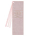 Pink bookmark with decorative text on a white background
