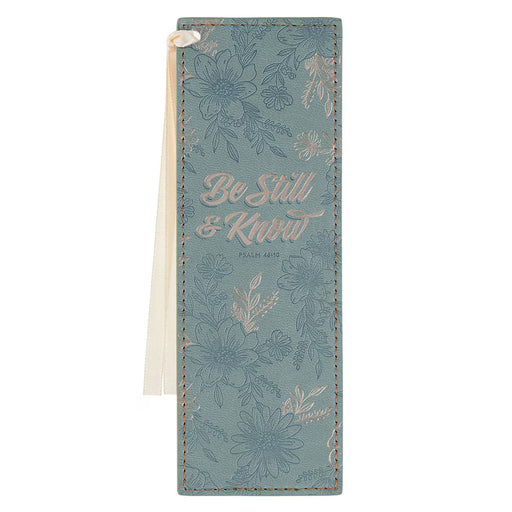 Floral-patterned notebook with 'Be Still & Know' text on a white background