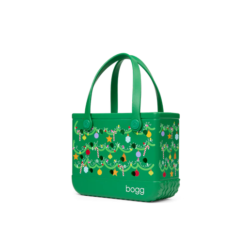 Green handbag with festive design and 'bogg' branding on a white background