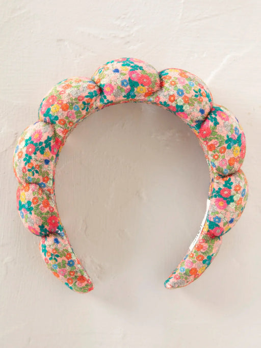 Floral patterned headband on a light background