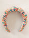 Floral patterned headband on a light background