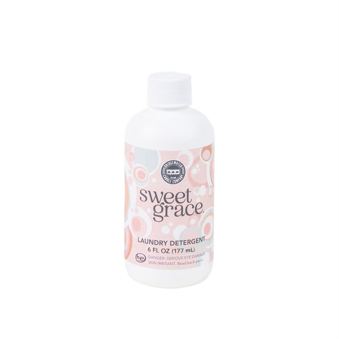 Bottle of Sweet Grace laundry detergent on a white background
