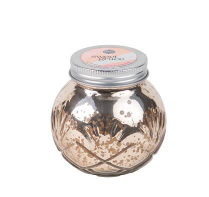 Decorative glass jar with metallic finish and silver lid on a white background